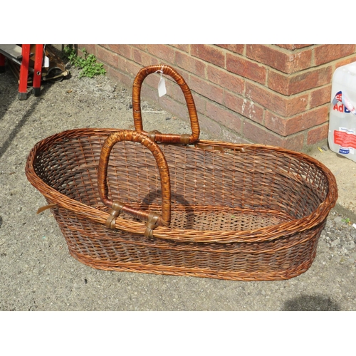 974 - Large Wicker Moses basket with handles. H:12 X W:34 X D:24 inches. (dog not included)