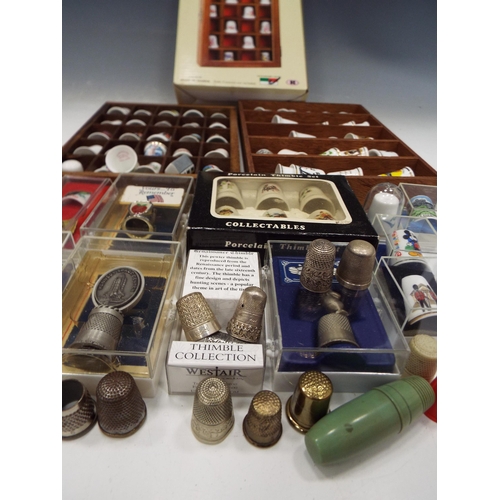 886 - Job lot of Thimbles, 2 of which are sterling silver & display stands.