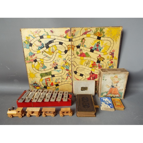 911 - Selection of vintage games and a small leather and brass bound bible.