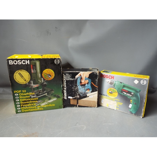 983 - Bosch drill and router plus a black and decker power saw.