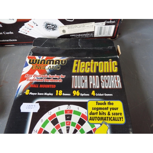 1009 - Winmau Electronic touch pad scorer, a poker set and a set of dominoes.