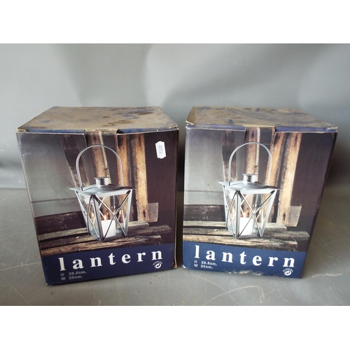 1030 - 2 As new boxed Candle garden lanterns.