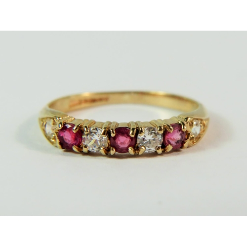 106 - 9ct Yellow gold Ruby and clear gemstone set ring. Finger size 'L'  1.6g.  Hallmark for Birmingham 19... 