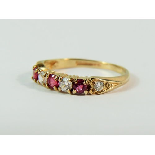 106 - 9ct Yellow gold Ruby and clear gemstone set ring. Finger size 'L'  1.6g.  Hallmark for Birmingham 19... 