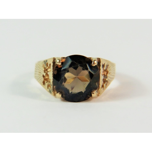 109 - 9ct Yellow Gold ring set with a 9mm circular smokey Quartz.  Finger size 'N'  3.4.  clear hallmarks ... 