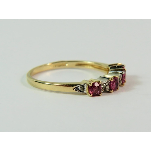 111 - 9ct Yellow Gold Ruby and Diamond set ring comprising four Rubies and five Melee Diamonds.  Finger si... 