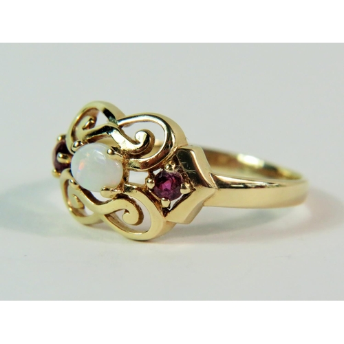 115 - Pretty 9ct Yellow Gold Amethyst and Opal set ring in an open scrolled mount. Finger size 'P'   2.2g