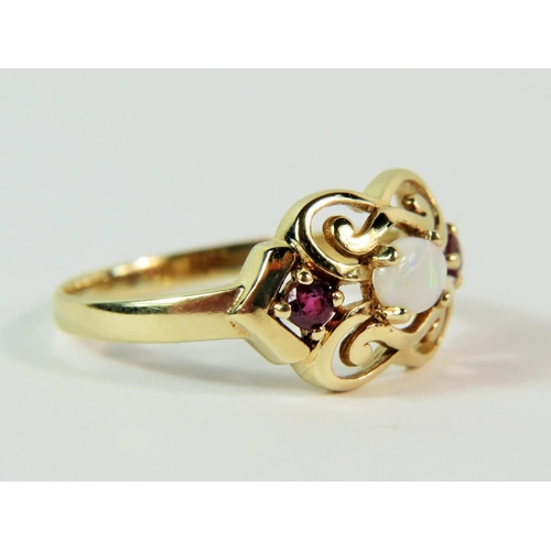 115 - Pretty 9ct Yellow Gold Amethyst and Opal set ring in an open scrolled mount. Finger size 'P'   2.2g