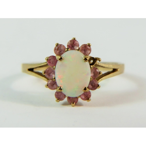 148 - 9ct Yellow Gold ring set with a Central Opal with a halo of pink Tourmaline. (one stone missing)  M-... 