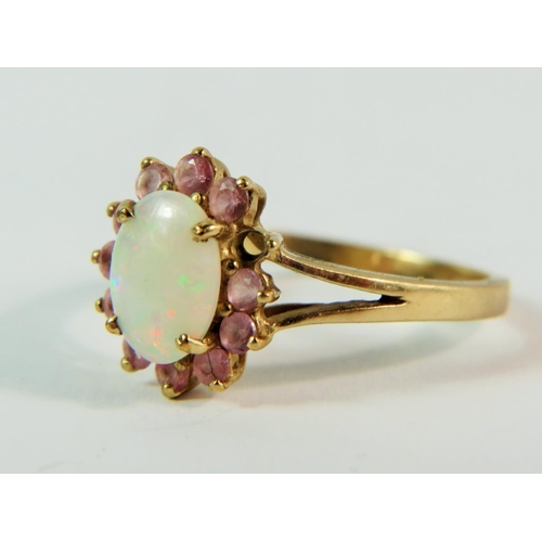 148 - 9ct Yellow Gold ring set with a Central Opal with a halo of pink Tourmaline. (one stone missing)  M-... 