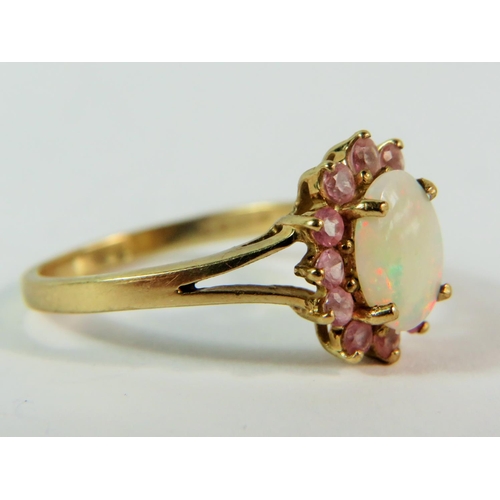 148 - 9ct Yellow Gold ring set with a Central Opal with a halo of pink Tourmaline. (one stone missing)  M-... 