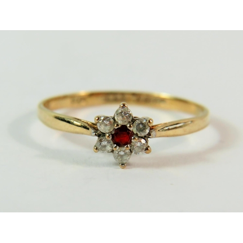 159 - 9ct Yellow Gold CZ gemstone ring set in a flower pattern.  Finger size 'M-5'  0.9g