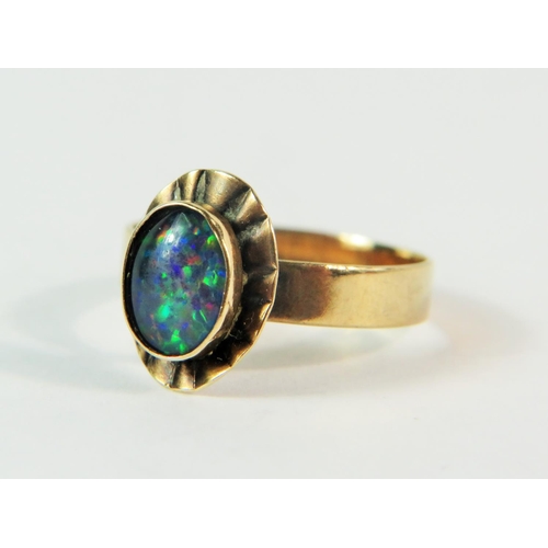 163 - 9ct Yellow Gold ring set with a central Blue/Green Opal. Finger size 'M-5'   1.8g