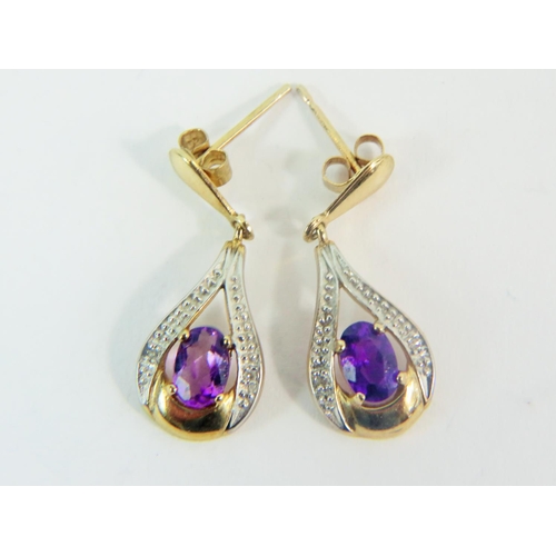 167 - Pair of 9ct Yellow Gold drop earrings set with Amethysts. Total weight  2.0g