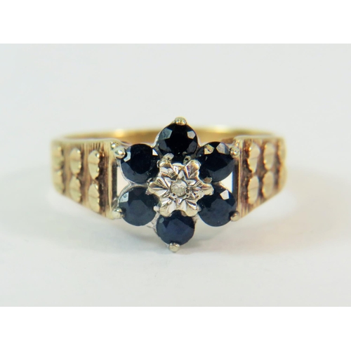 170 - 9ct Yellow Gold ring set with Small 150th pt Diamond and Six 10mm Sapphires. Finger size  'P-5'  3.7... 