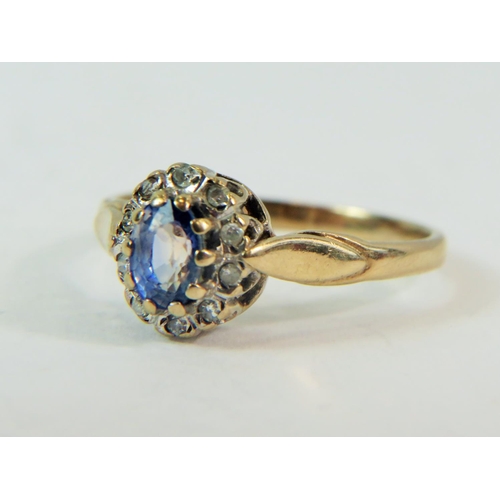 182 - 9ct Yellow Gold ring set with a 5 x 4 mm Topaz surrounded by a halo of 10 Melee Diamonds. Finger siz... 