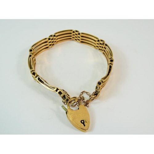 186 - 9ct Yellow Gold Four bar gate bracelet with heart shaped clasp and chain.  7 inch bracelet.  Total w... 