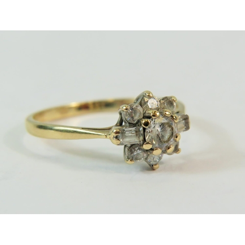 189 - 9ct Yellow Gold Multi CZ Gemstone set ring in a flower pattern.   Finger size 'P'  2.2g