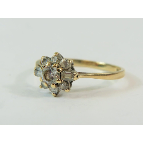 189 - 9ct Yellow Gold Multi CZ Gemstone set ring in a flower pattern.   Finger size 'P'  2.2g