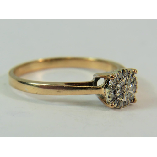 190 - 9ct yellow gold Multi Diamond set ring in a starburst pattern.  Finger size 'P'  2.0g     0.10pts Di... 