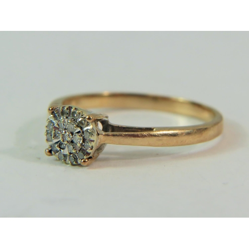 190 - 9ct yellow gold Multi Diamond set ring in a starburst pattern.  Finger size 'P'  2.0g     0.10pts Di... 