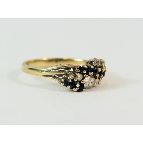 192 - 9ct Yellow Gold ring set with mulitple Diamonds and Sapphires.  Finger size 'M-5'  1.9g