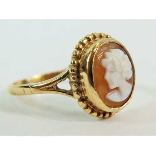 199 - 9ct yellow Gold Ring set with a shell cameo.   Finger size 'L'  2.6g