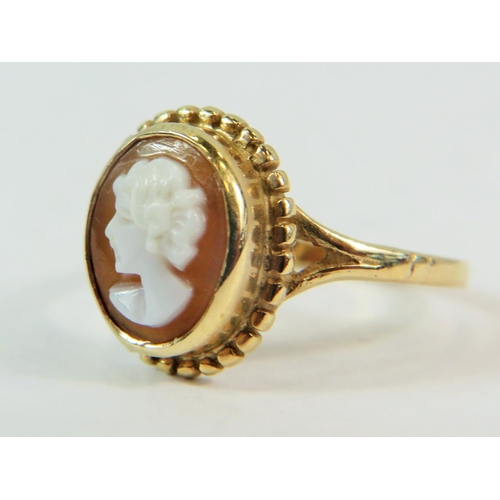 199 - 9ct yellow Gold Ring set with a shell cameo.   Finger size 'L'  2.6g