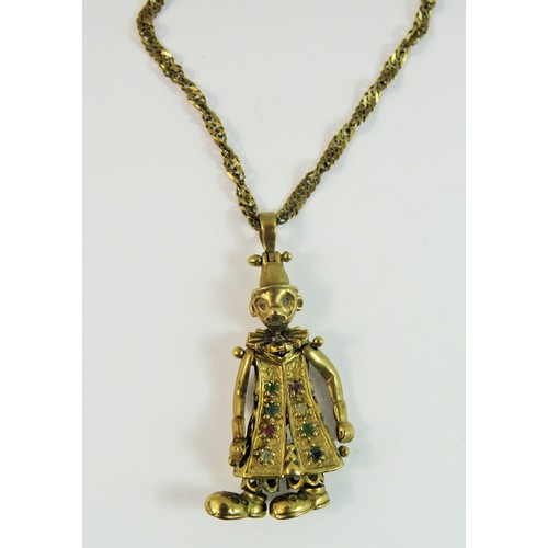129 - 9ct Gold Articulated pendant figure set with gemstones hung upon a 9ct yellow gold 24 inch twist lin... 