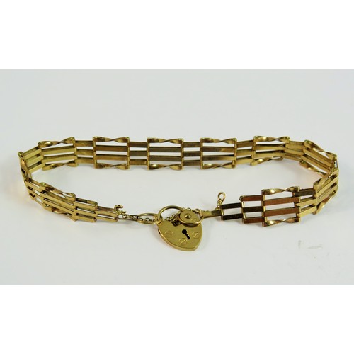 130 - 9ct Yellow Gold Four bar gate bracelet with heart shaped clasp and chain.  7 inch bracelet.  Total w... 