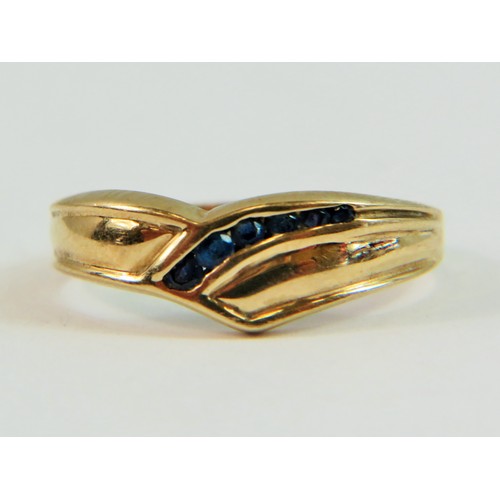 137 - 10ct Yellow Gold ring set with seven Sapphires in a wave pattern. Finger size 'N'   3.4g