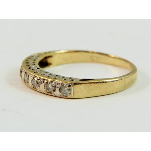 143 - 9ct Yellow Gold ring set with seven Diamonds of approx 0.25pts   Finger size 'N-5'   1.9g