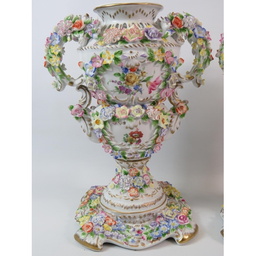 367 - Pair of modern Dresden highly decorated with flowers urn vases. Standing 12.5