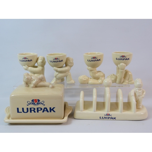 74 - Lurpack butterdish, toast rack and 4 egg cups.