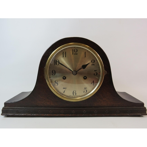 76 - Oak cased Mantle clock in working condition comes with key and Pendlum, it measures 9