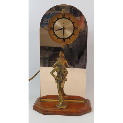 78 - Smith sectric art deco figural clock with mirrored back and spelter figurine.