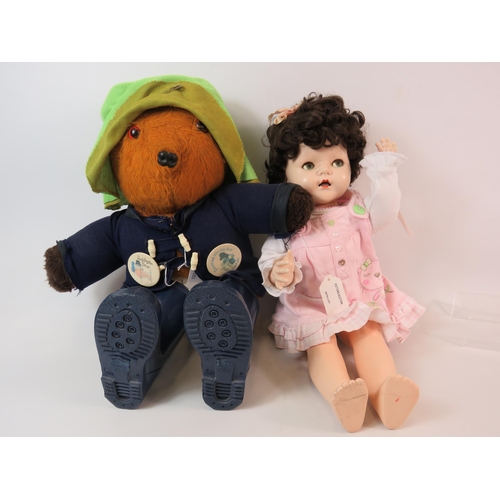 83 - Vintage Paddington bear teddy plus a vintage plastic doll.