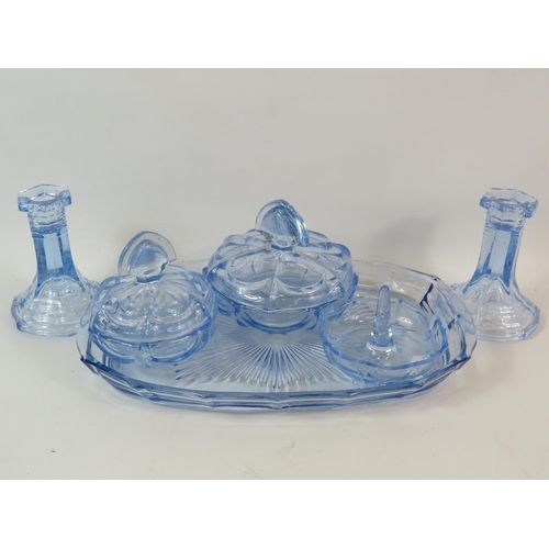 99 - Art deco blue glass dressing table set.