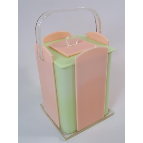 391 - Vintage Art deco lidded Bakelite perspex storage jar in pastel colours. Approx 8