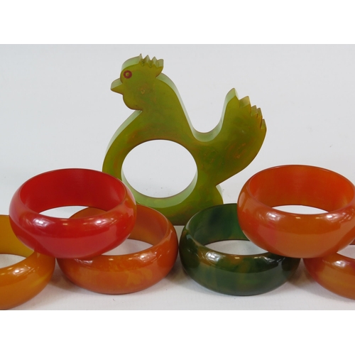 405 - Selection of vintage Bakelite napkin rings including one in the form of a chicken.