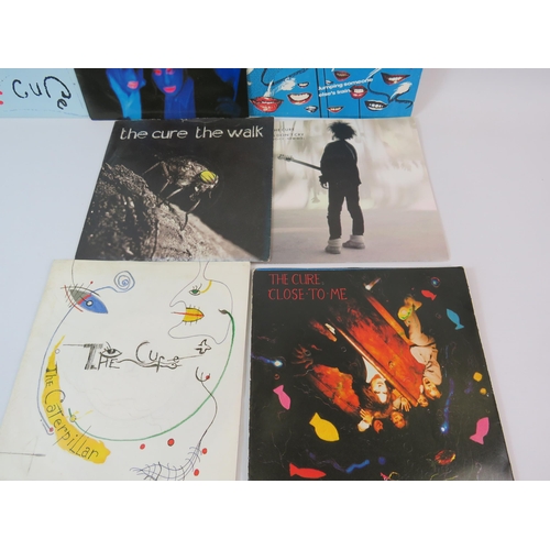 466 - The Cure 7 x single records with picture sleeves.