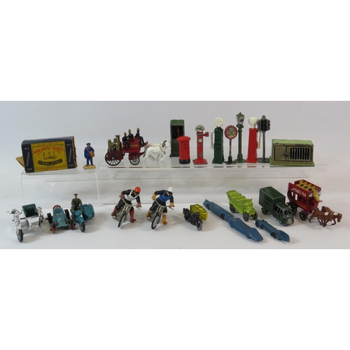 514 - Good selection of playworn vintage diecast signs, petrol pumps, motorbikes etc.