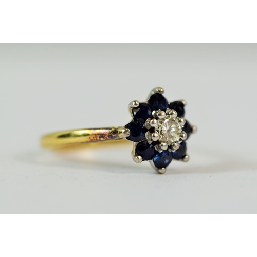 203 - 18ct Yellow Gold Ring set with a central Diamond of 0.15ct  surrounded by Eight Deep colour Sapphire... 