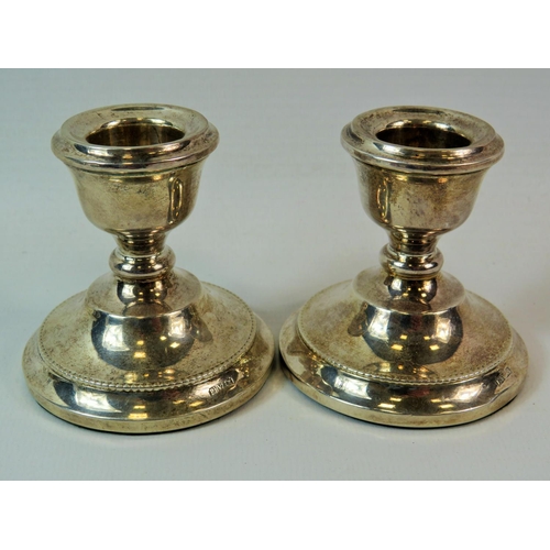 247 - Pair of Hallmarked silver stubby boudoir candlesticks. Each 3 inches tall. See photos