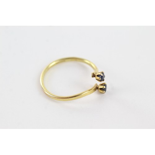 256 - 9ct gold sapphire twin stones twist setting ring (1.3g)    755004