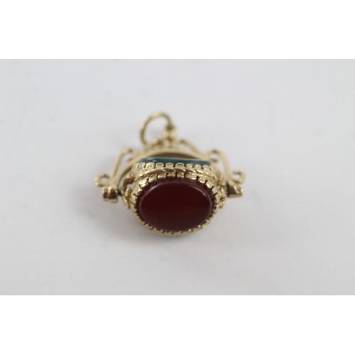 270 - 9ct gold vintage bloodstone, onyx & carnelian spinner fob pendant (3.1g)    755970