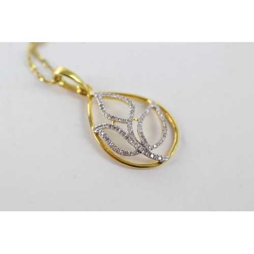 273 - 9ct yellow & white gold diamond set floral openwork pendant necklace (1.5g)    755587