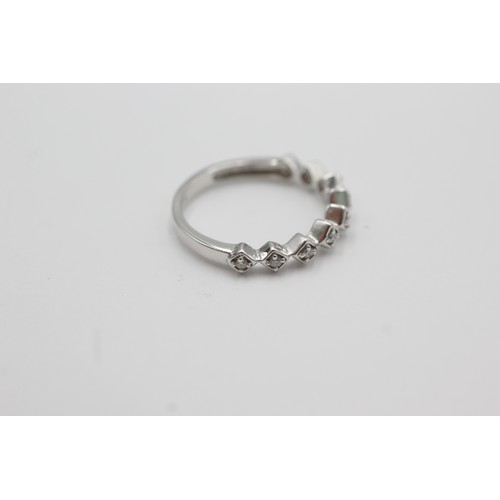 279 - 9ct white gold diamond stylised half-eternity ring (2.3g)    755556