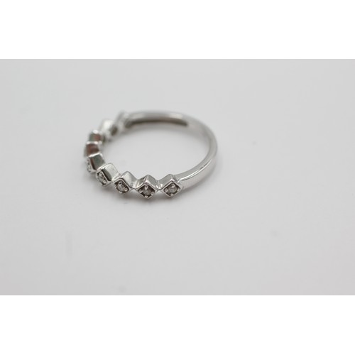 279 - 9ct white gold diamond stylised half-eternity ring (2.3g)    755556