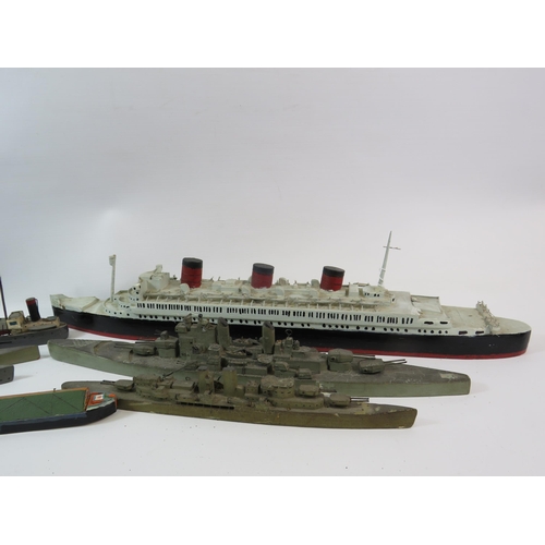 669 - Selection of handmade wooden boats, war ships etc.